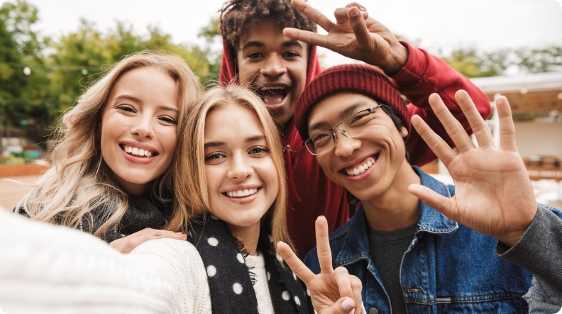 Group of teenagers taking selfie outdoors
